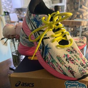 ASICS women's Gel-Ecite 9 white/black sneakers.